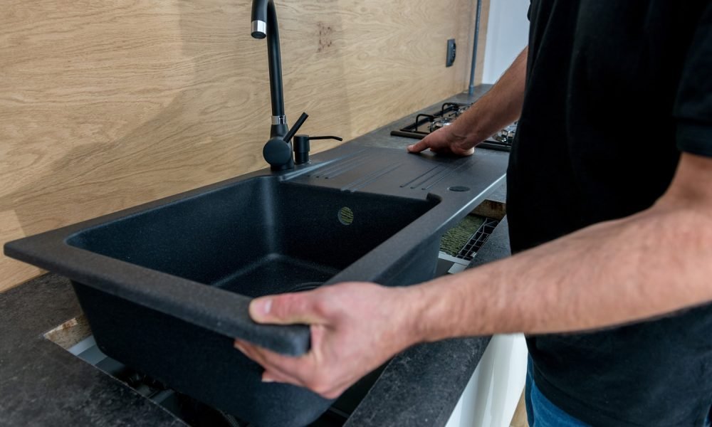 Installing-a-new-ceramic-sink-in-kitchen